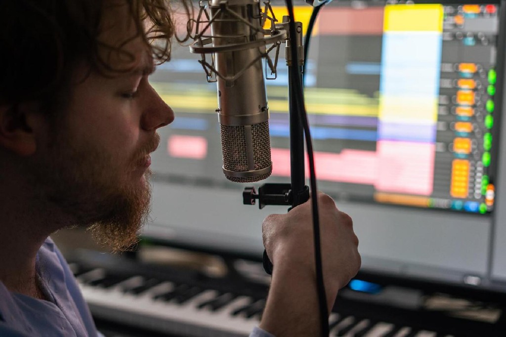 James Corley recording vocals in the studio